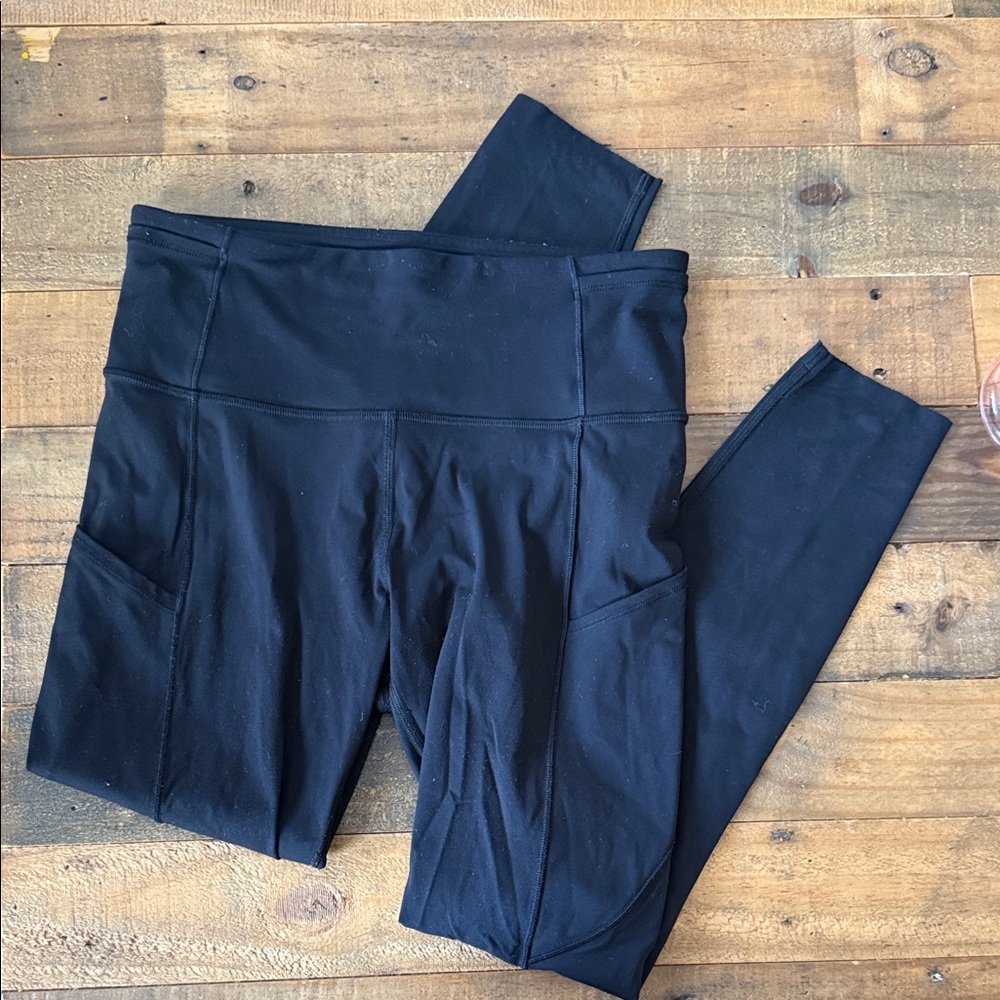 Lululemon - black leggings with side pockets and ankle detail